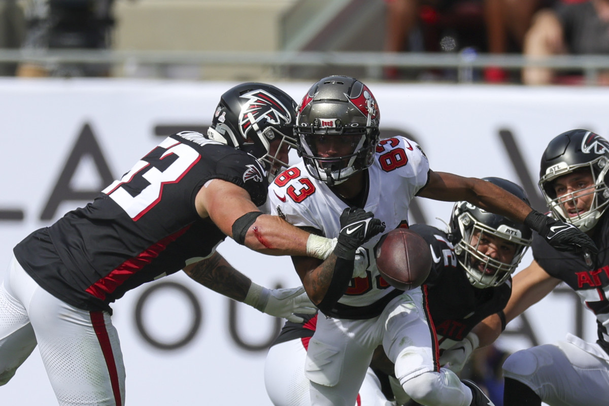 Oct 22, 2023; Tampa, Florida, USA; Atlanta Falcons linebacker Nate Landman (53) causes a fumble by Tampa Bay Buccaneers wide receiver Deven Thompkins (83) in the third quarter at Raymond James Stadium.  